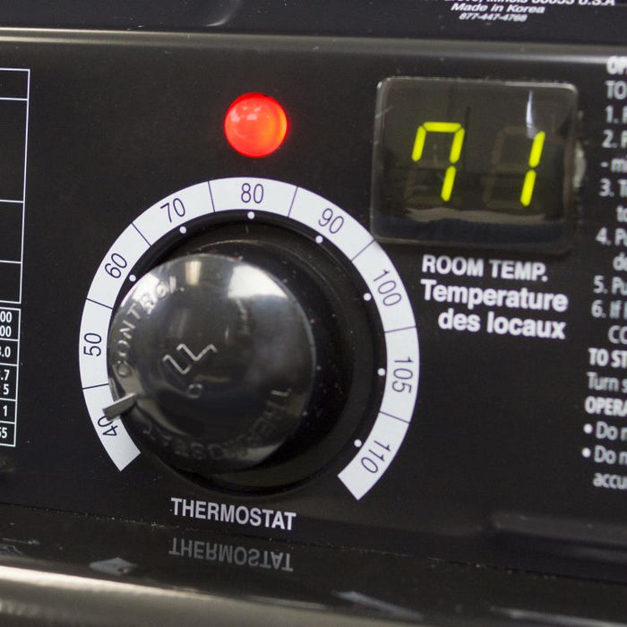 Close-up of the thermostat dial and digital room temperature display on the Dyna-Glo Delux heater
