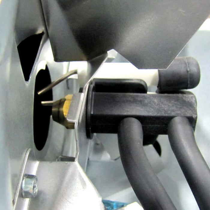 Close-up of the igniter and fuel nozzle assembly inside the Dyna-Glo Delux kerosene heater