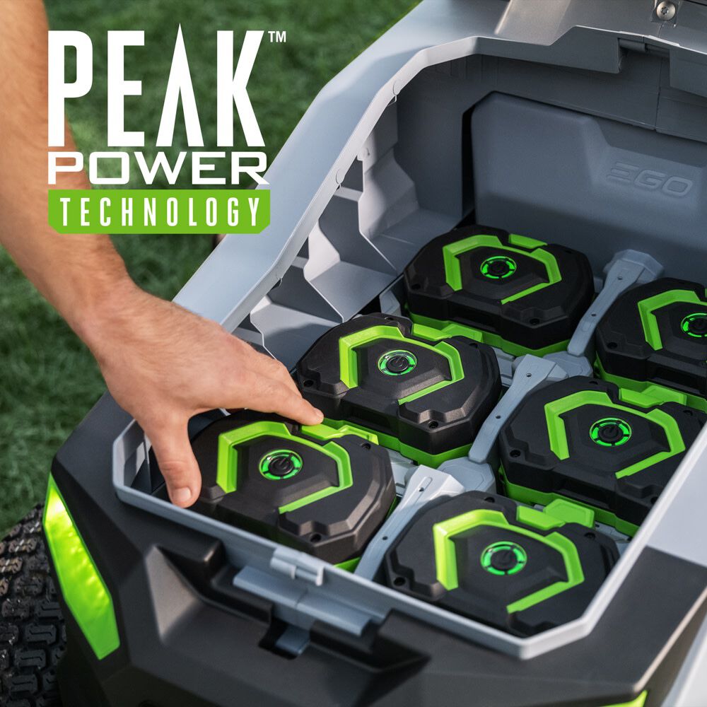 Peak Power technology: hand loading 56V batteries into the battery bay of the EGO T6 lawn tractor
