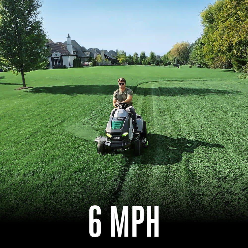 6 mph top speed: operator driving the EGO POWER+ T6 riding lawn tractor towards the camera