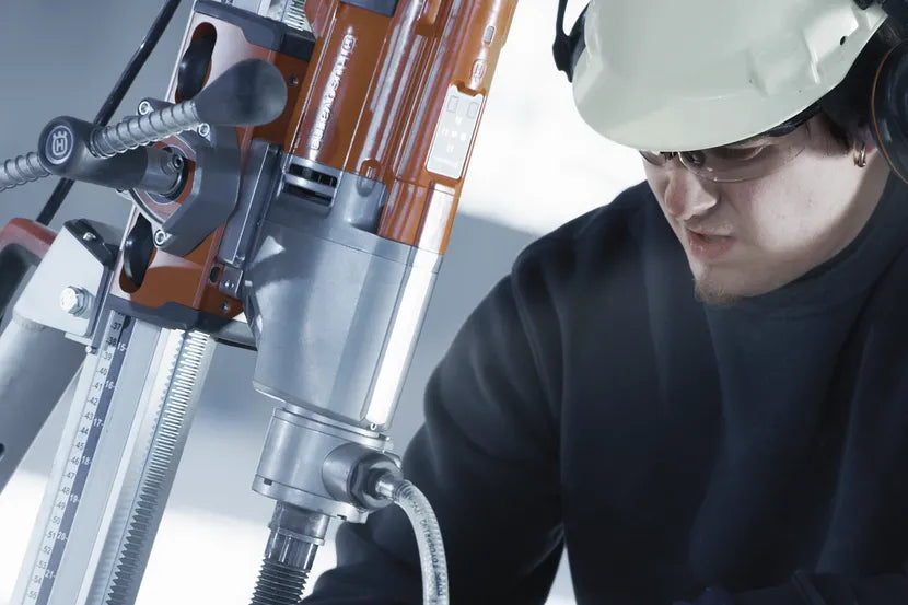 Close-up of the Husqvarna DM 220 drill mounted on a coring stand
