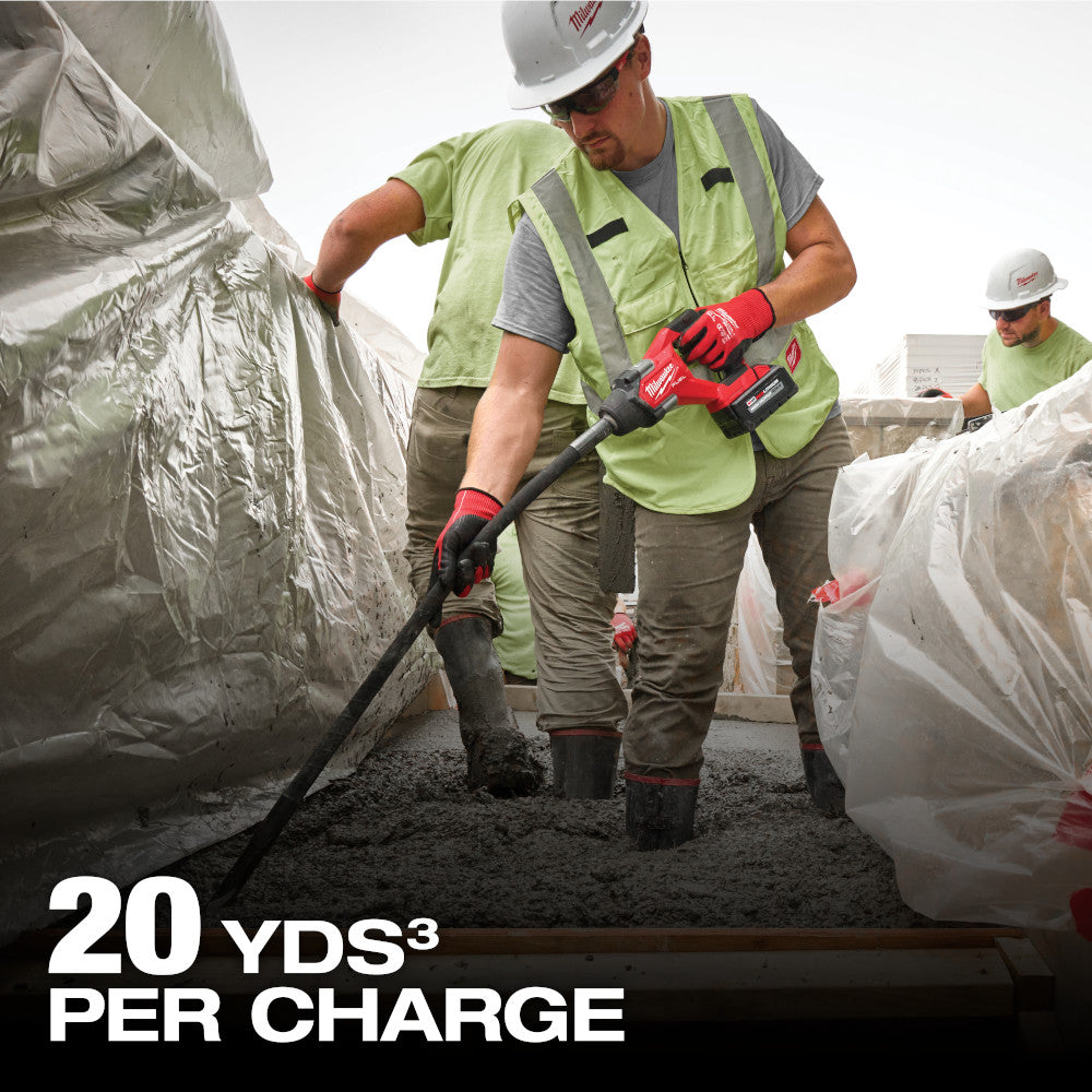 Workers consolidating a reinforced slab with the M18 FUEL pencil vibrator