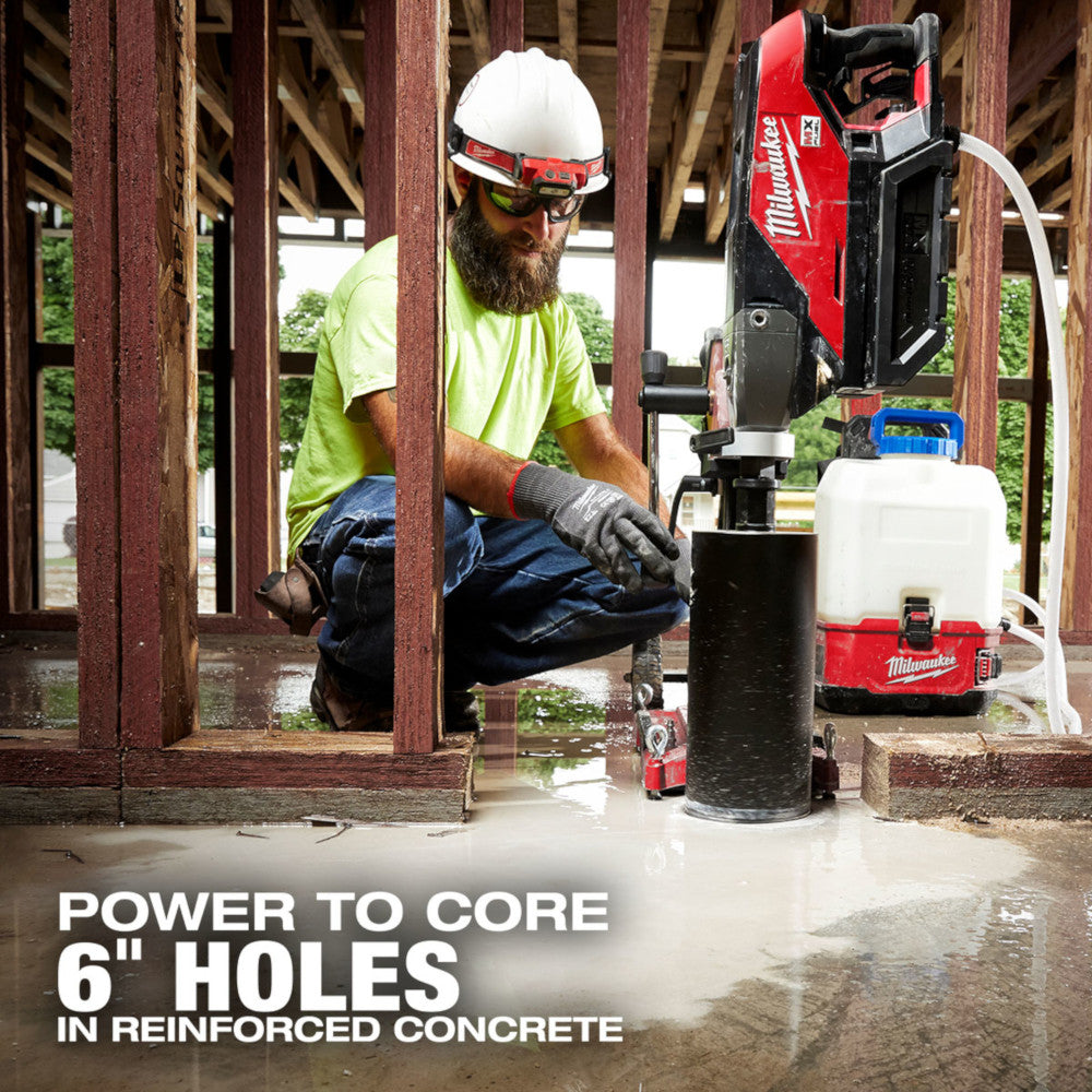 Operator coring a floor in a timber-framed building with the MX FUEL handheld core drill